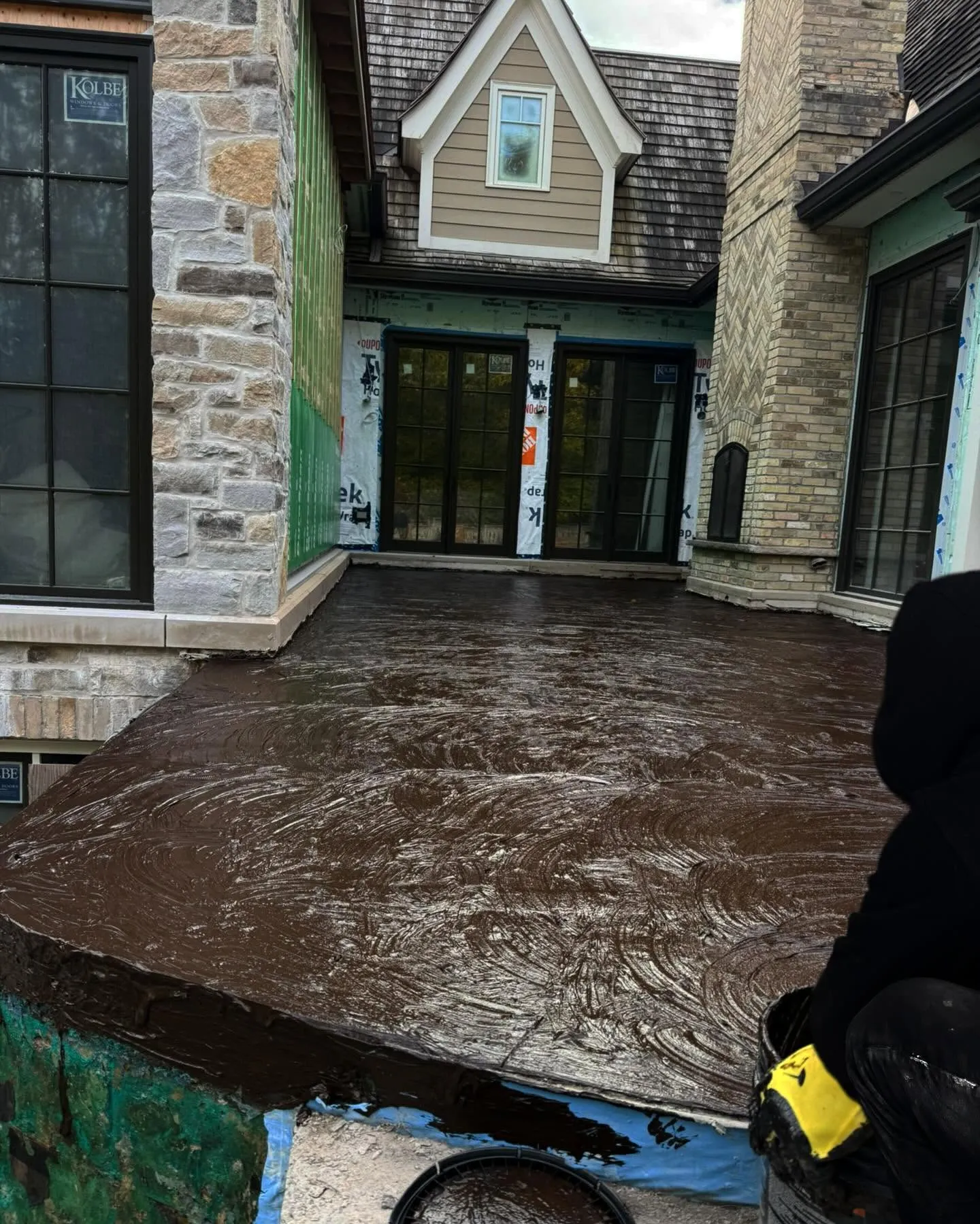 Waterproofing membrane being applied across a concrete surface on a Toronto project